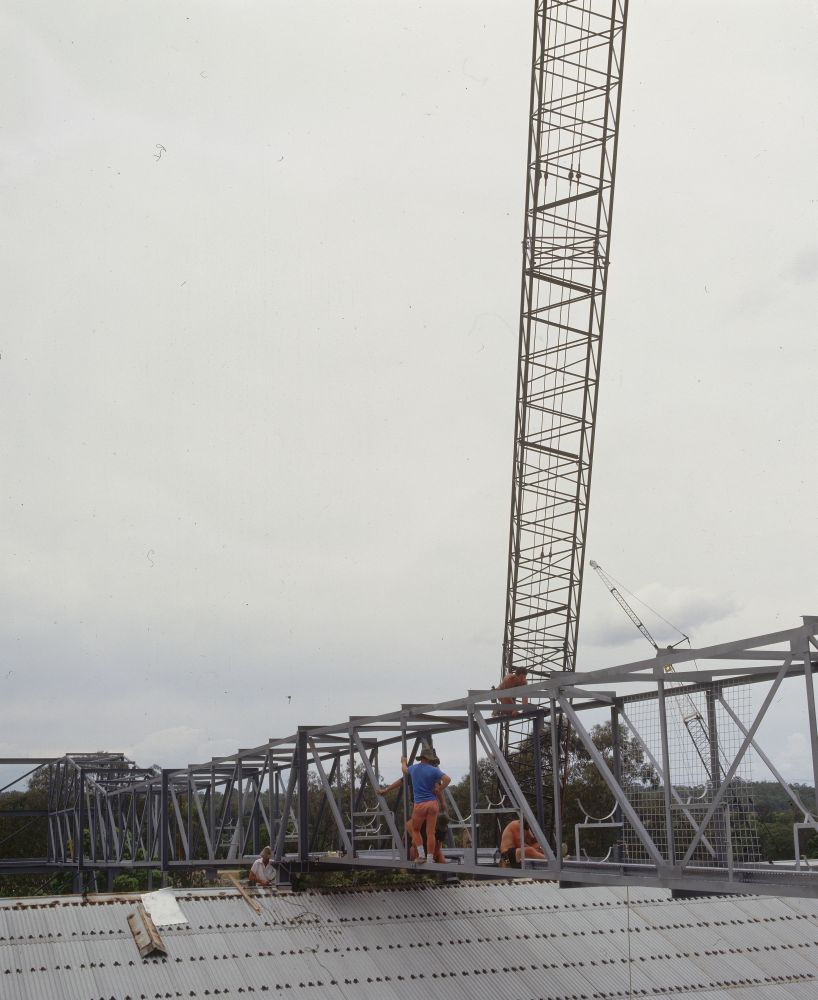 Working on steel frame construction outside building