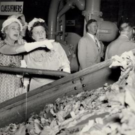 Dignitaries being taken on a tour of the Mill
