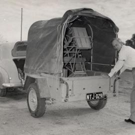 Car with covered trailer