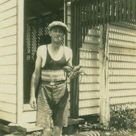 Mr Billy (?) Metcalf holding a mud crab