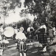 Christmas Party - Bag pipe band playing in shade of trees