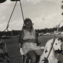 Christmas Party - Child on merry-go-round