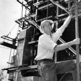 Clarrie Dunstan standing on framework