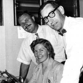 Al Blumer and Harry Thomas (with an unidentified office worker)