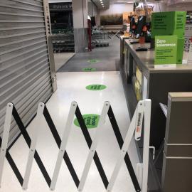 Woolworths Supermarket - Warner Marketplace Samsonvale Road Warner - 10 April 2020 - signage and barrier to create single exit