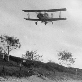 Fertilising the sand dunes at Woorim to encourage vegetation in 1982