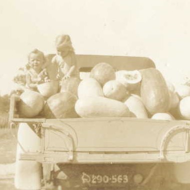 Joan and Carole Lehman with a truckload of watermelons from their parents' farm in the 1940s