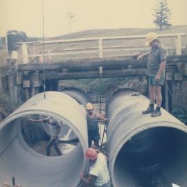 Pipes being laid, Laceys Creek Road Laceys Creek, ca. 1986