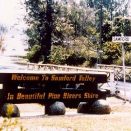 Entry sign to Samford Valley over Samford Creek