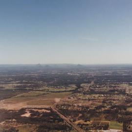 Aerial view towards the Glass House Mountains (Qld.), 1996