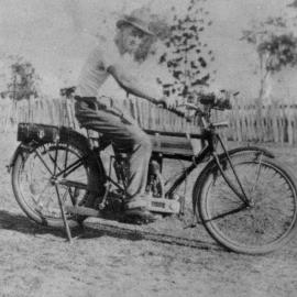Joseph Coulthard riding a Douglas motorcycle, ca. 1930