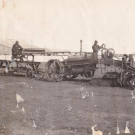 Two men driving and operating graders, ca. 1930