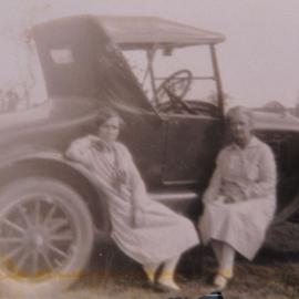 Two women with a vintage car, ca. 1930s
