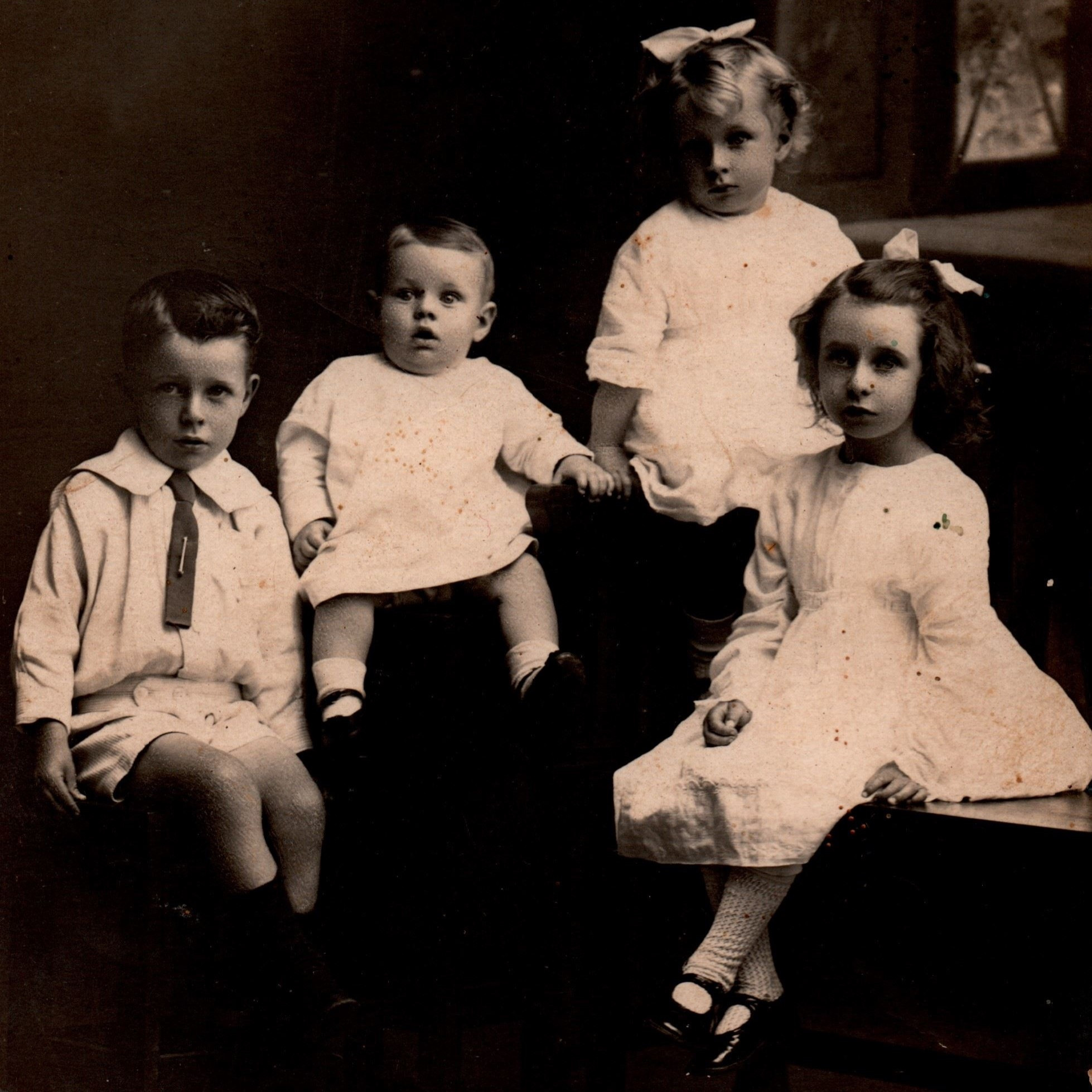 Photograph of four young children