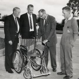 4 men with wheelchair