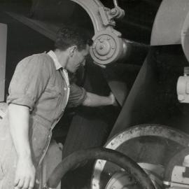 Don Kerr working on machinery