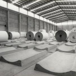 Cartonboard Rolls on Platforms in Storage Shed