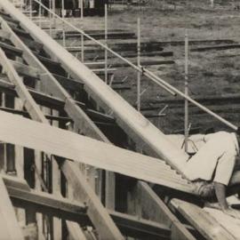 Corrugated iron being laid on the roof
