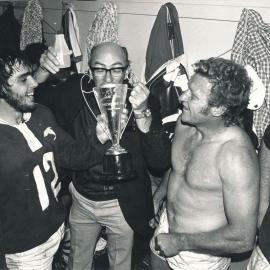 Tosser Turner drinking from trophy cup