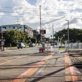 Railway level crossing on Todds Road Lawnton - looking west towards apartment building