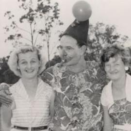 Clown with two unidentified women