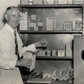Charley Langley stocking the shelves