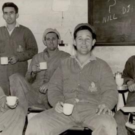 5 Male Workers having tea