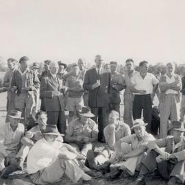 C.S. Burton & A.S. Gehrmann having a drink with the workers