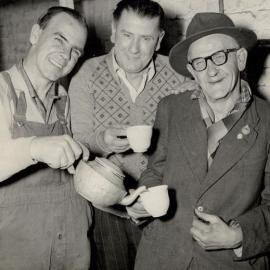 3 Workers sharing a cup of tea