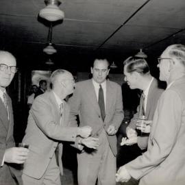 5 Men in suits talking