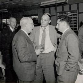 4 Men in suits talking