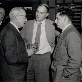 4 Men in suits talking