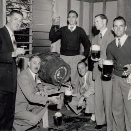 6 Men around a beer keg