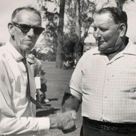 Arch Kerr shaking hands with Hugh Wagner